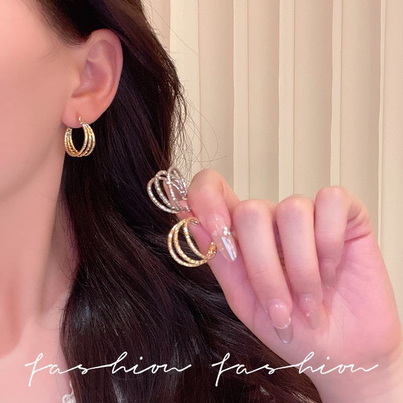 Silver three-layer twisted ear loops for women 2025 cross-border new style personalized and trendy earrings, European and American simple and cold style ear buckles details Picture