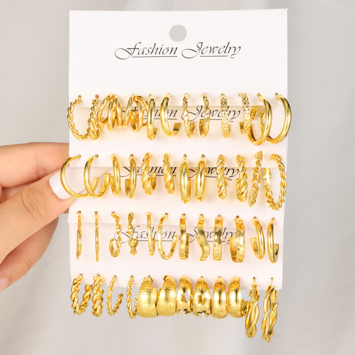 A 24-piece set of cross-border best-selling European and American style golden three-tube wavy twist earrings with a feminine, light luxury and high-end feel full figure