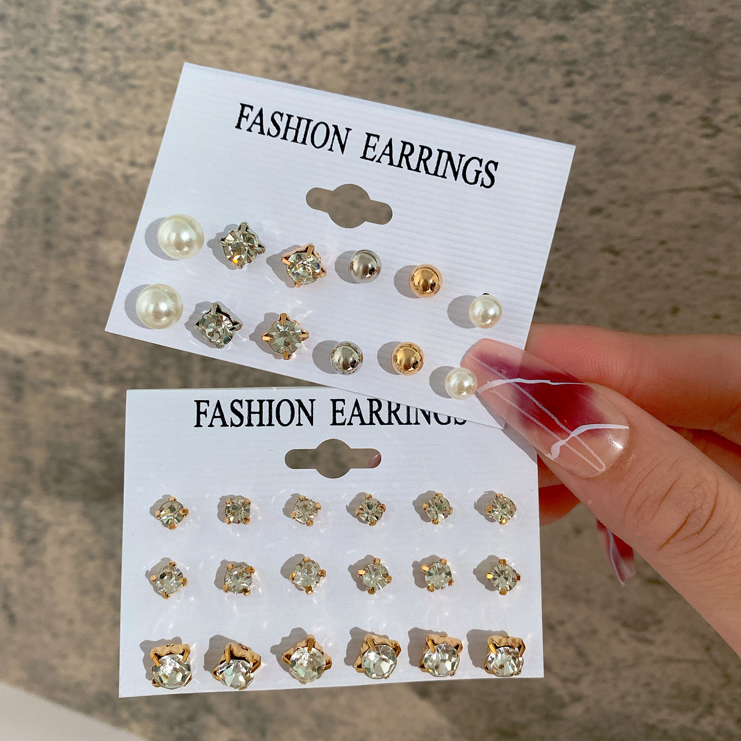 Wholesale of a new set of 9-pair creative, retro and minimalist four-pronged zirconia stud earrings from Europe and America full figure