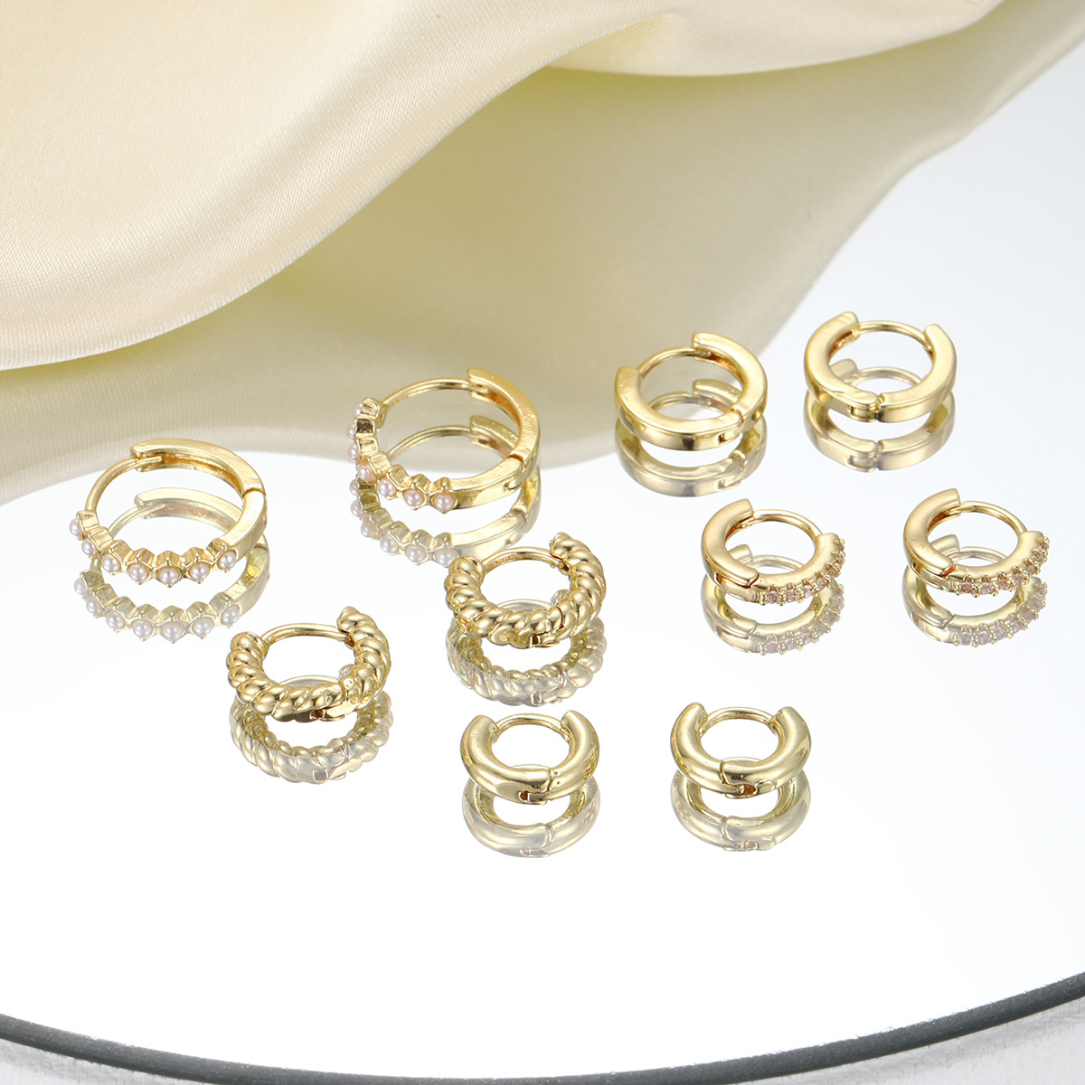New cross-border imitation pearl earrings from Europe and America, with rhinestone ear rings, simple ear buckles and retro twisted metal ear ring earrings Application Scenario