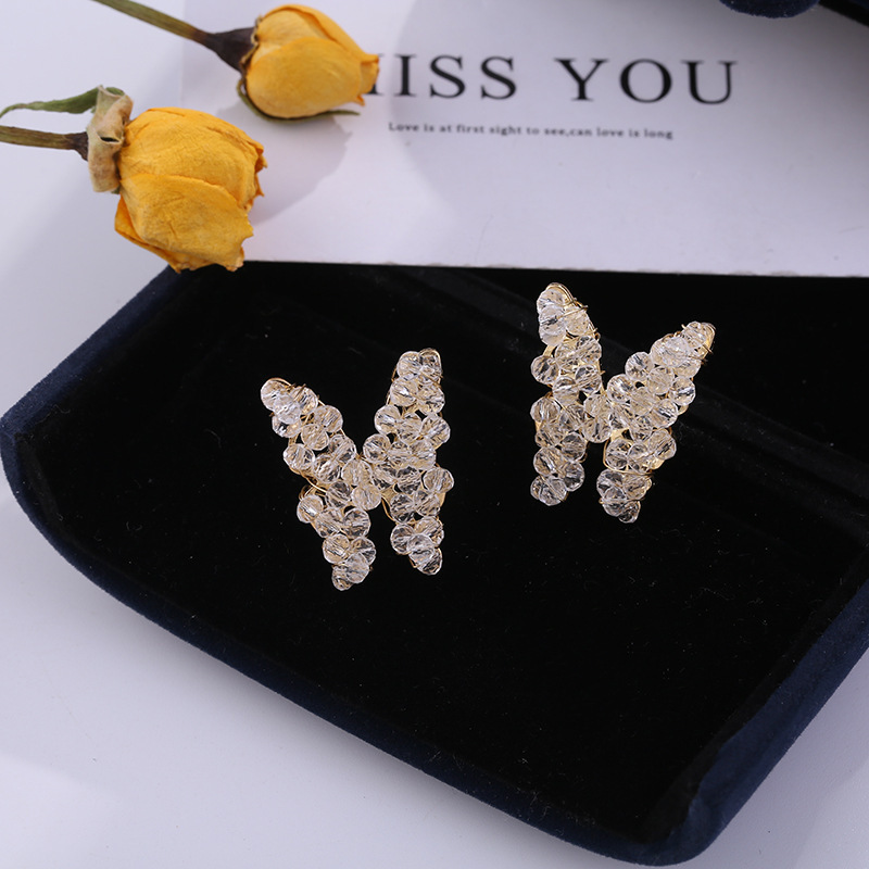 S925 Silver needle hand-woven sparkling pearl butterfly earrings, simple and elegant Korean stud earrings for women full figure
