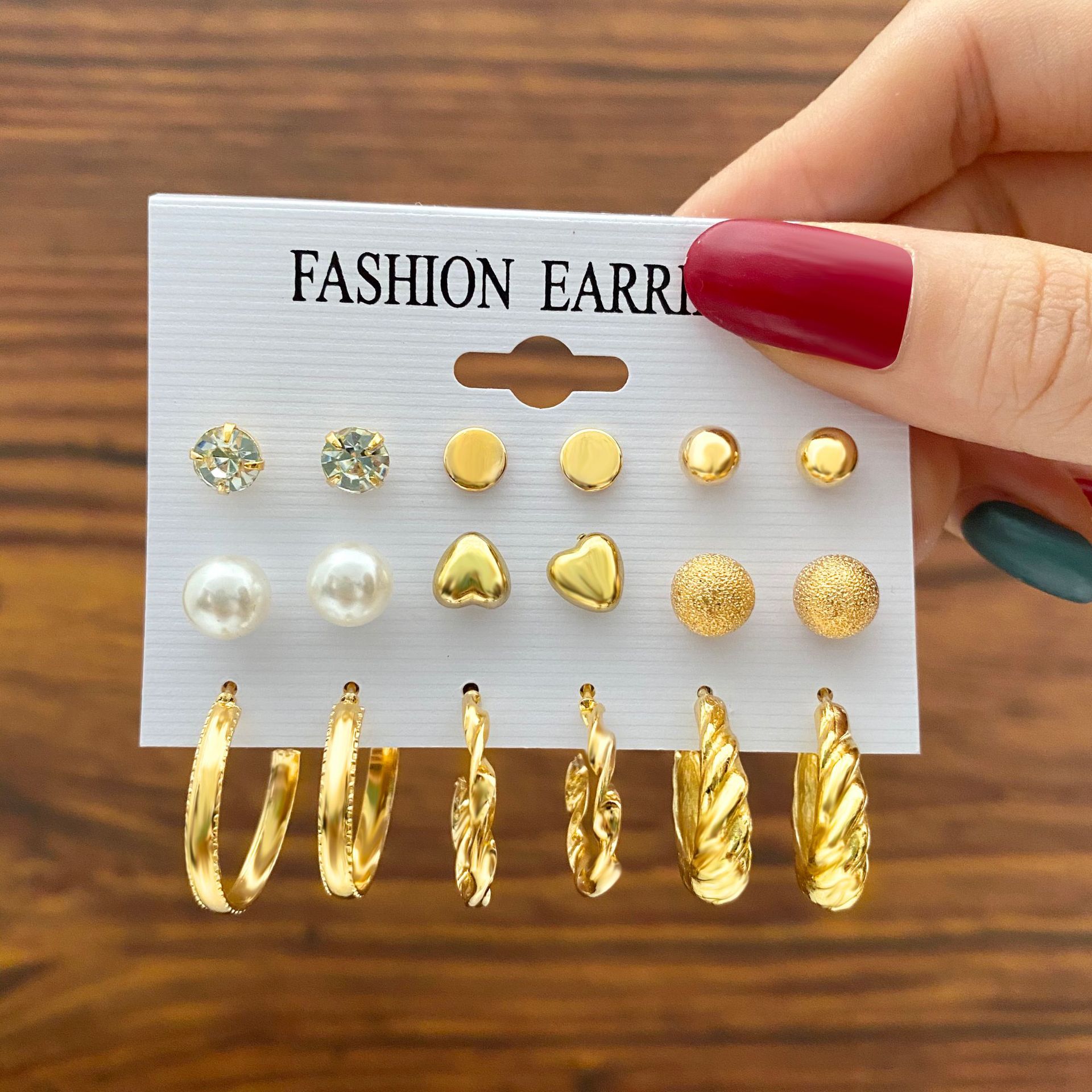 Wholesale of new and simple cross-border earrings from Europe and America. Creative, simple and retro imitation pearl circle stud set, 9 pairs full figure