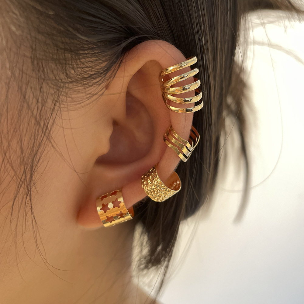 Creative and simple gold ear bone clip four-piece set, metal personalized star-shaped hollowed-out C-shaped ear clip set full figure