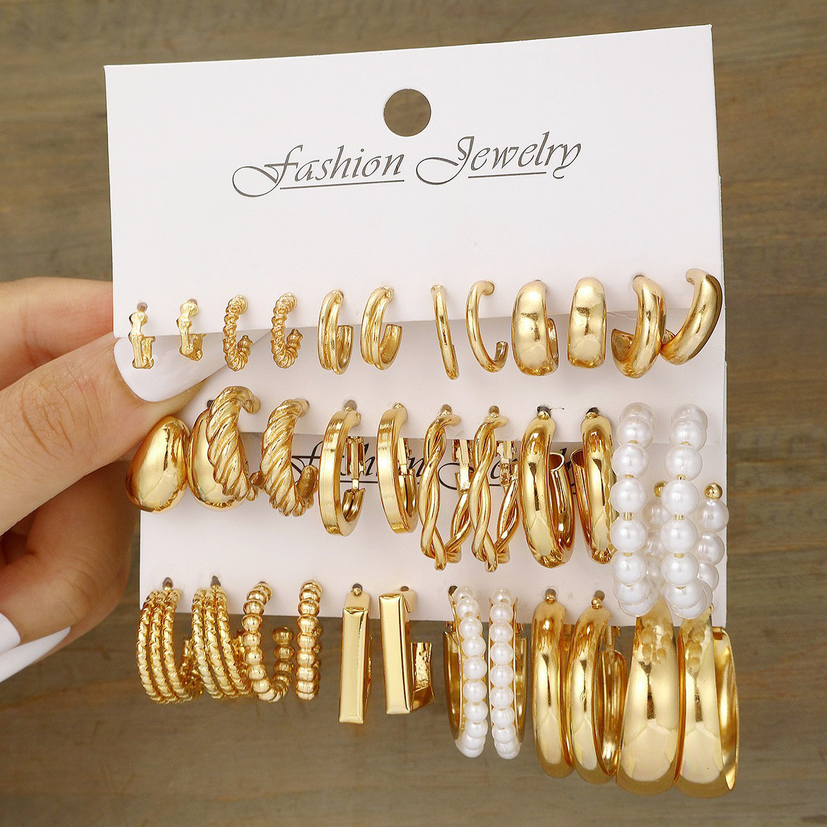A creative and personalized 8-piece set of European and American cross-border fashion ins metallic geometric round pearl imitation pearl earrings full figure
