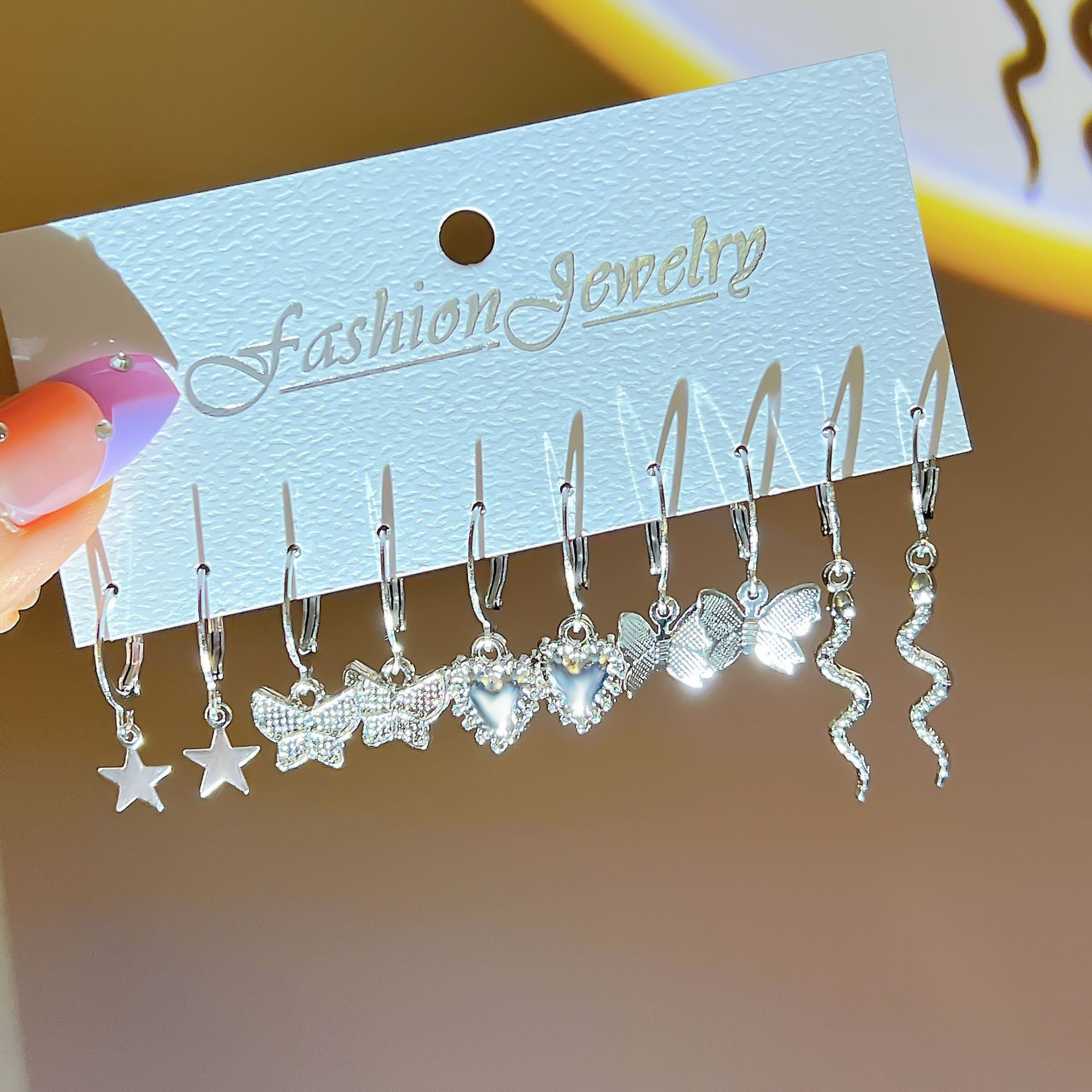 Wholesale of new cross-border butterfly imitation pearl earrings, creative and simple five-pointed star moon earrings set of 9 pairs full figure