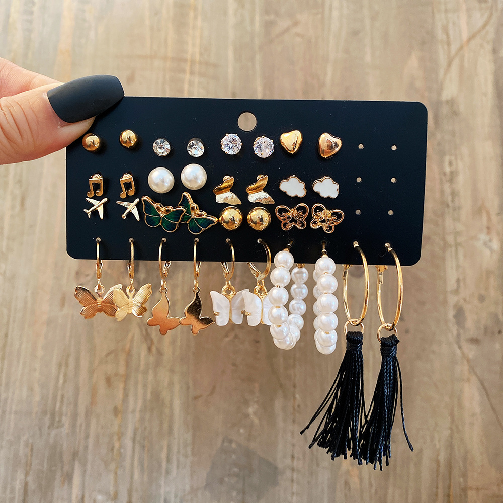A 17-piece set of creative and retro gold butterfly airplane tassel earrings with imitation pearl inlays from Europe and America full figure