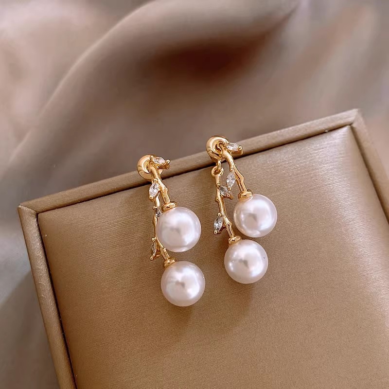 Golden zircon cross-leaf pearl stud earrings, a unique two-pair earring design for women, with a niche and elegant style. Silver needle earrings details Picture
