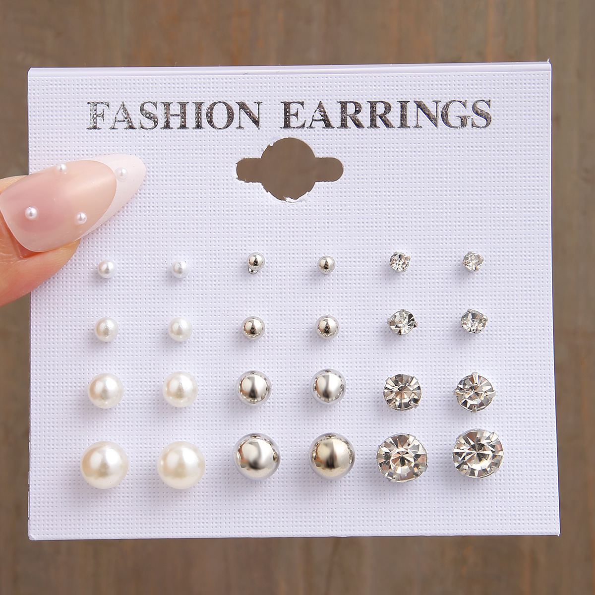 A 12-pair set of new cross-border ins personalized and simple round metal combination pearl zircon stud earrings from Europe and America full figure