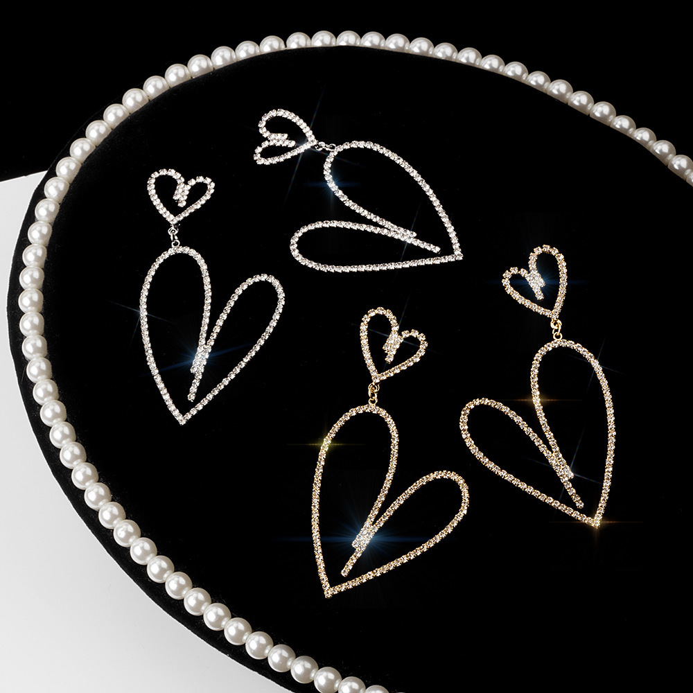 S925 Silver needle Dongdaemun Full Diamond hollowed-out long heart-shaped stud earrings with exaggerated hearts, European and American cold style earrings for women full figure