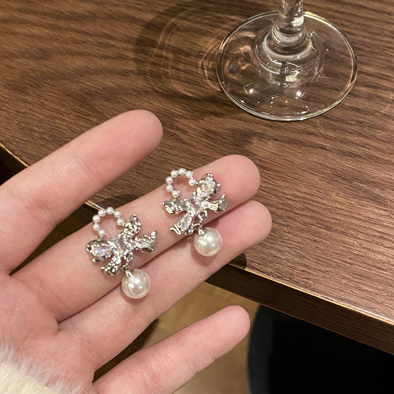 Korean-style exquisite bow pearl earrings, 925 silver needle high-end stud earrings, light luxury, internet-famous style earrings and accessories details Picture
