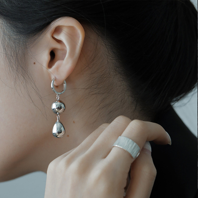European and American cold style silver round ball temperament earrings, ins heavy industry bell earrings, niche design sense, exaggerated ear buckles full figure