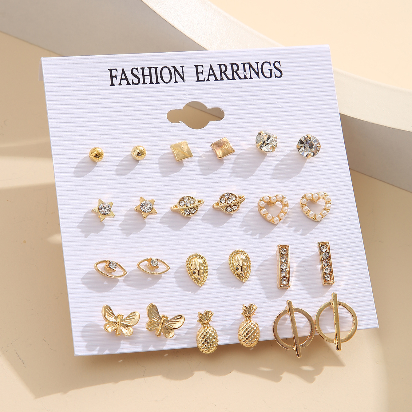 A 12-piece set of creative and simple pineapple teardrop stud earrings in an ins style with diamond hearts, starry sky eyes and geometric stud earrings Specification drawing