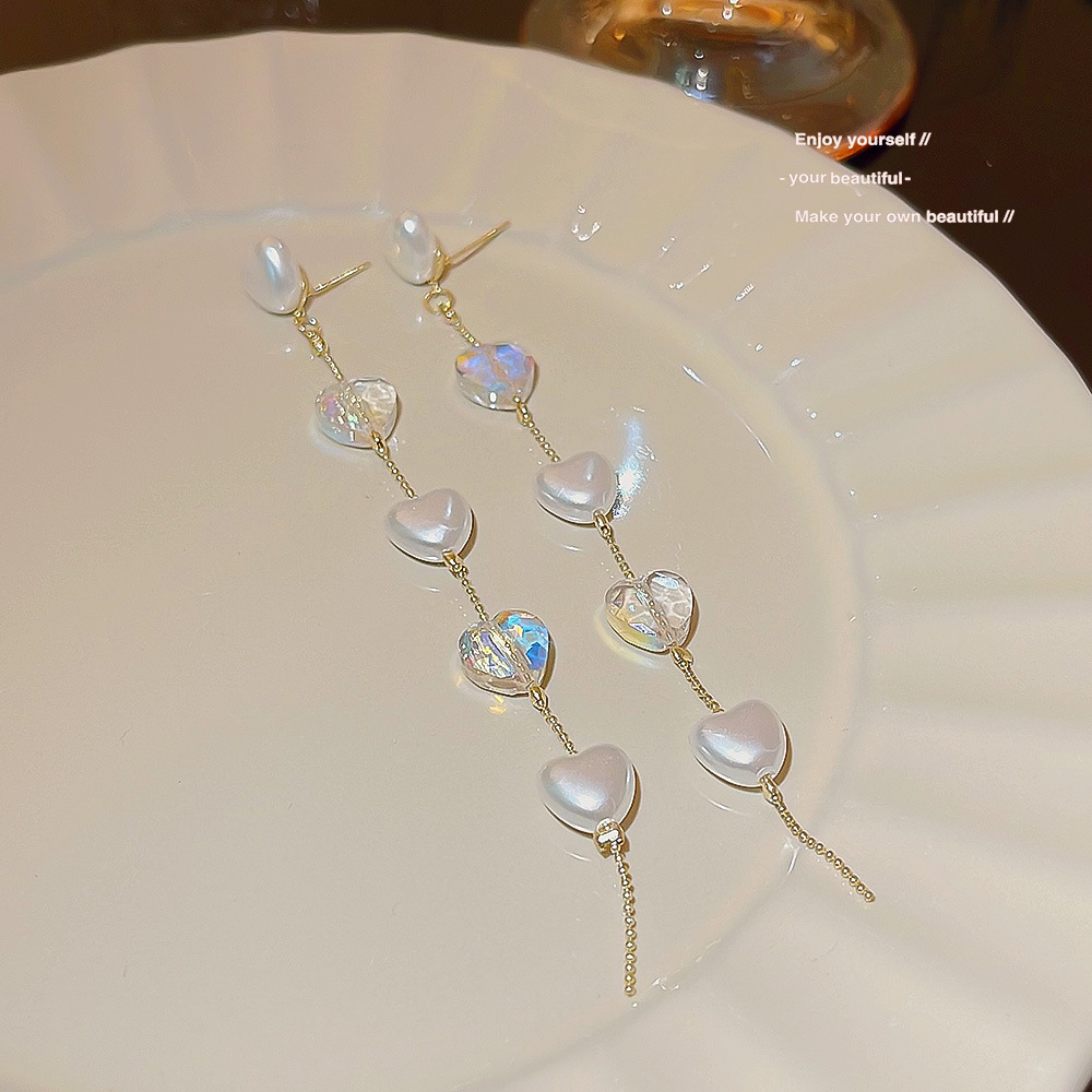 Long tassel crystal pearl heart-shaped earrings exude a sense of high-end luxury and a ladylike charm. These small and exquisite earrings can enhance your face details Picture