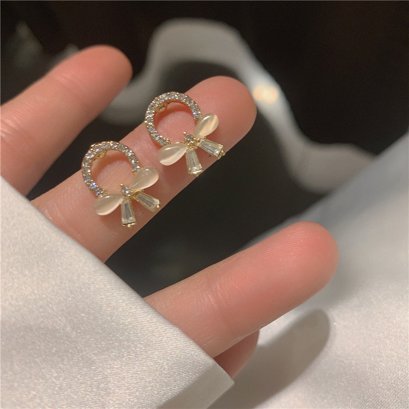 S925 Silver Needle New cat's eye stone bow stud earrings for women, small, simple and versatile Korean earrings, trendy and stylish for going out full figure