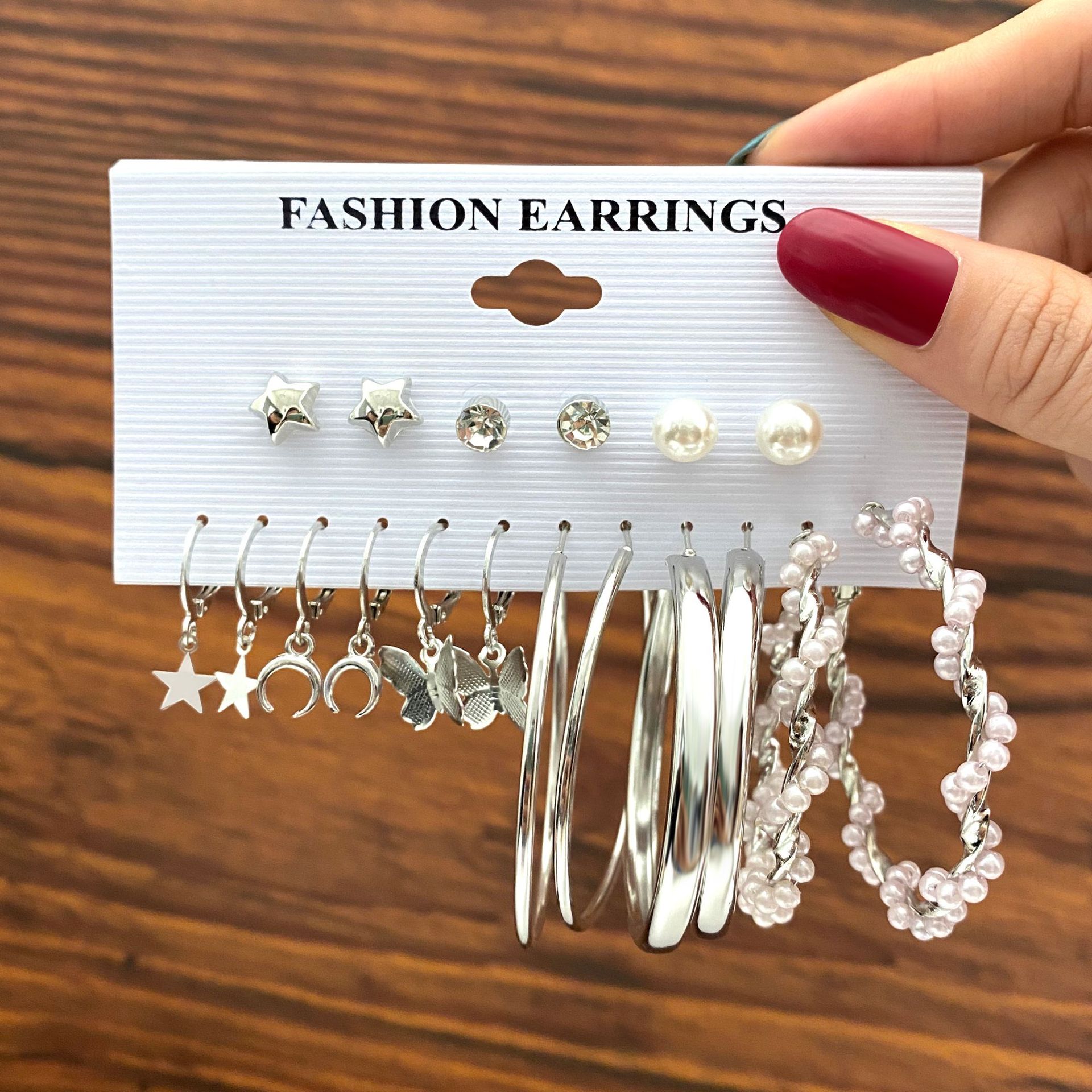 Wholesale of new cross-border silver butterfly imitation pearl earrings, creative five-pointed star moon earrings set of 9 pairs full figure