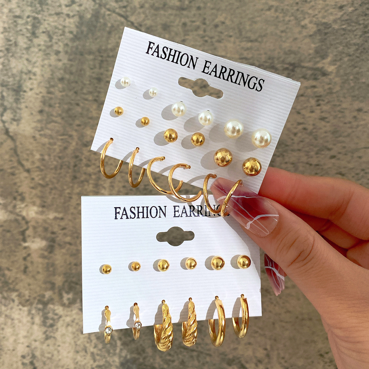 Wholesale of new cross-border earrings from Europe and America. Creative and simple imitation pearl open circle stud set, 9 pairs full figure