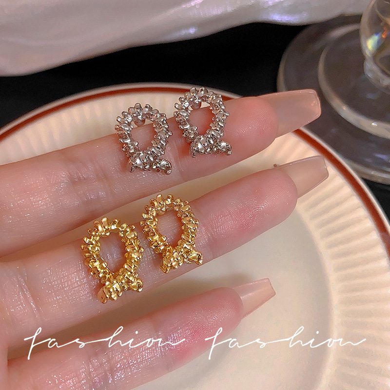 925 Silver needle irregular cross metal stud earrings with a light luxury and niche design sense, retro broken silver and elegant earrings full figure