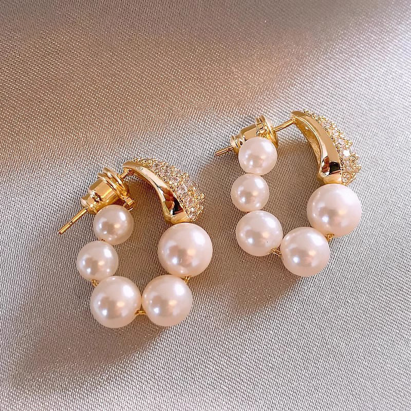 Zircon pearl earrings and ear rings are a niche design for women, exuding a sense of high-end luxury and uniqueness. They are unique stud earrings for cross-border commuting in Europe and America full figure