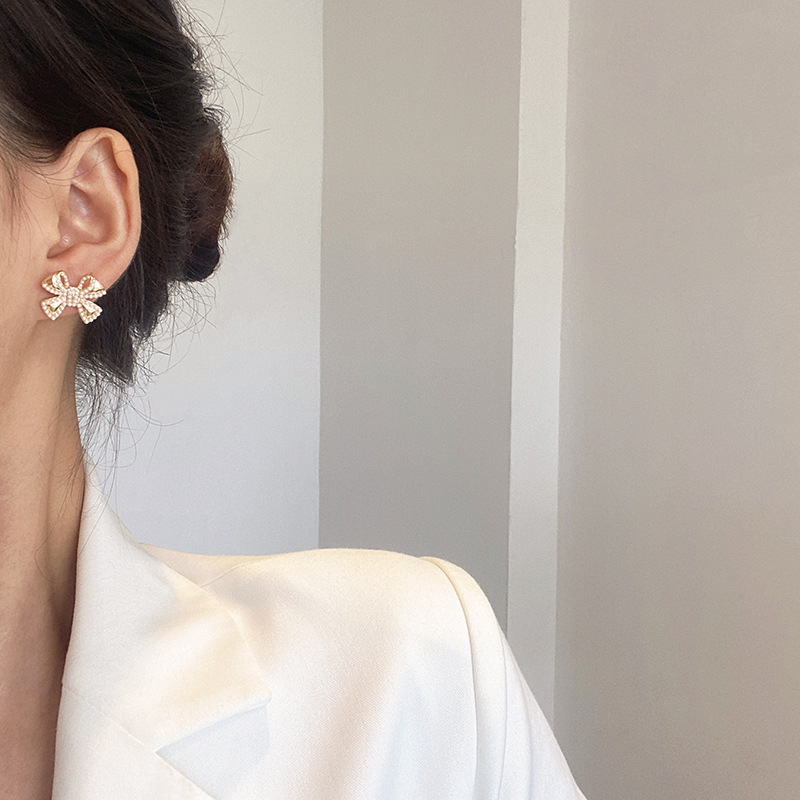S925 Silver needle pearl bow stud earrings, new trendy, simple and cold style earrings, delicate and small earrings for women details Picture