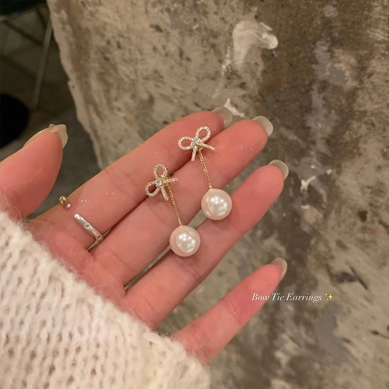 The back-hanging super flash zircon butterfly tassel pearl earrings are a unique, light luxury and high-end long stud earrings for women full figure