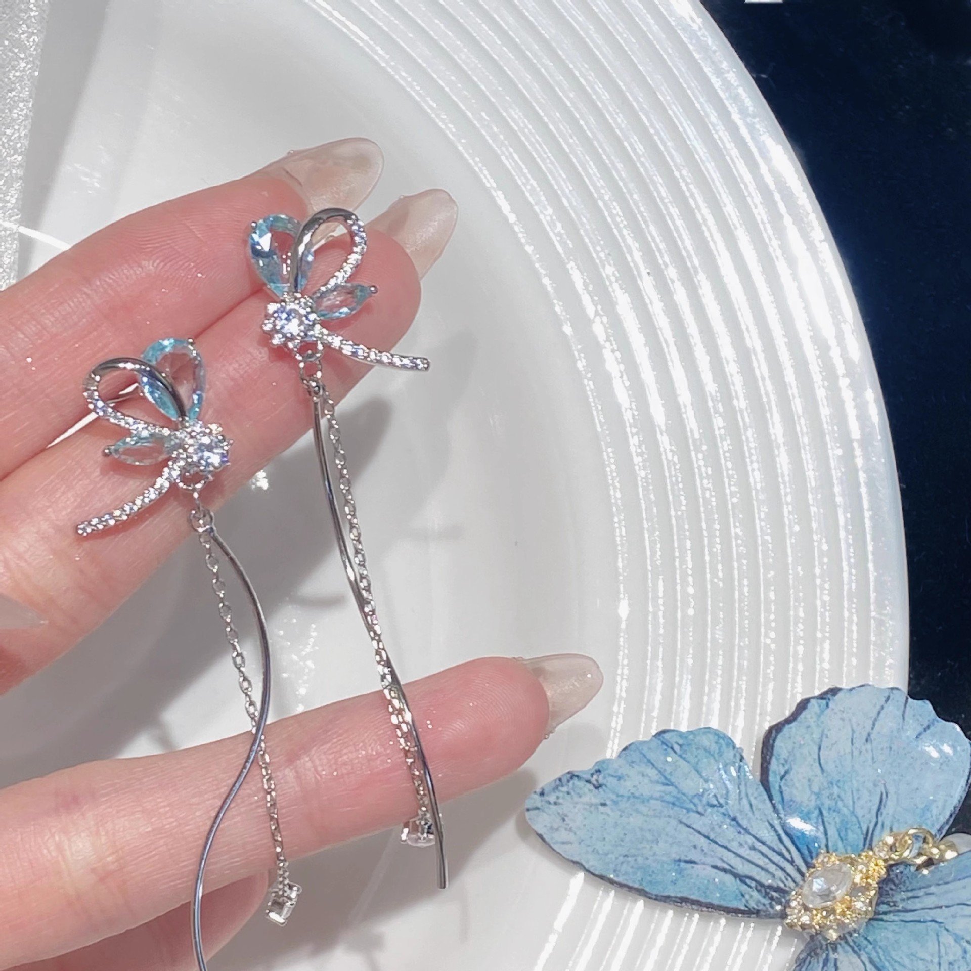 Korean version micro-inlaid long design sense butterfly zircon elegant flower stud earrings on Instagram super fairy-like round face slimming earrings for women full figure