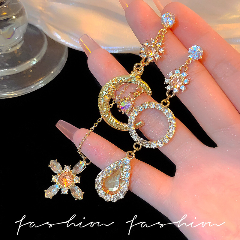 925 Silver Needle, European and American fashion, asymmetrical long, elegant and exaggerated earrings, Baroque tassel, Sun and moon, internet-famous earrings full figure