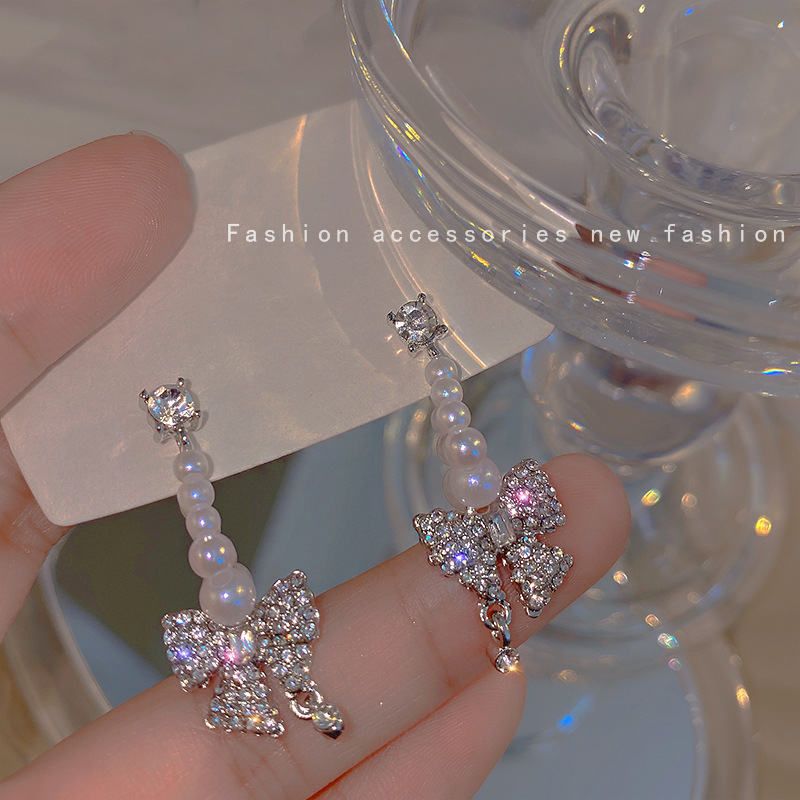 Long tassel pearl earrings from Dongdaemun, South Korea, with a cold and elegant feminine design, are light luxury earrings and diamond-encrusted bow earrings full figure
