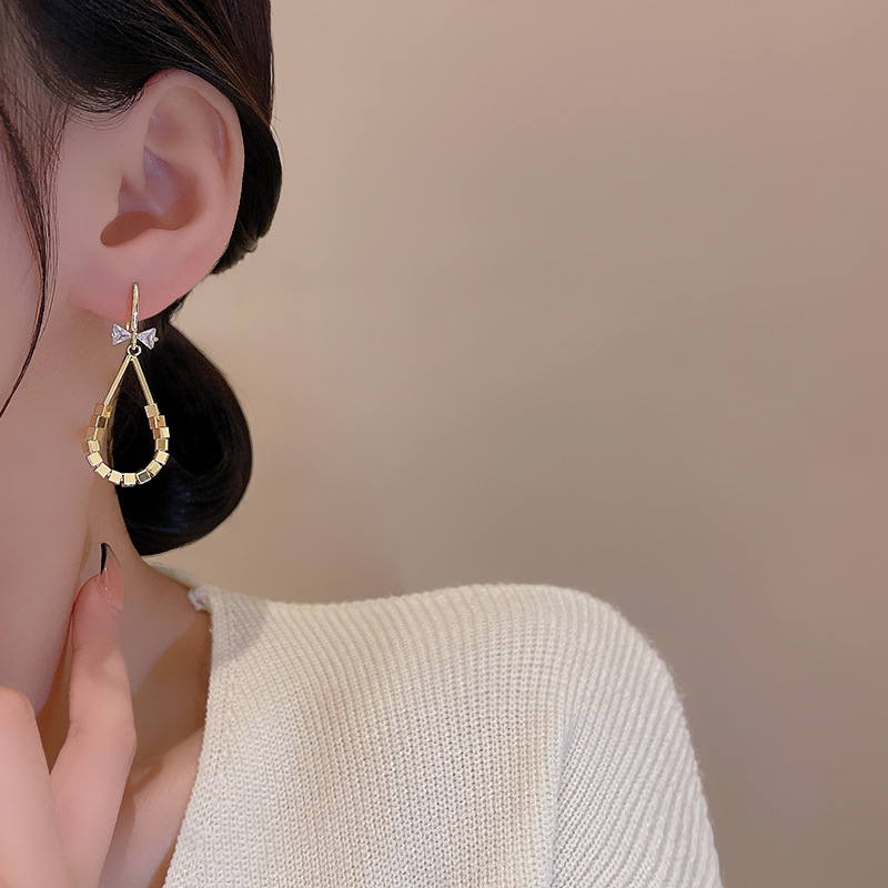 Micro-inlaid zircon bow ear hooks, European and American style, unique square style earrings, 925 silver needle, high-end earrings Application Scenario