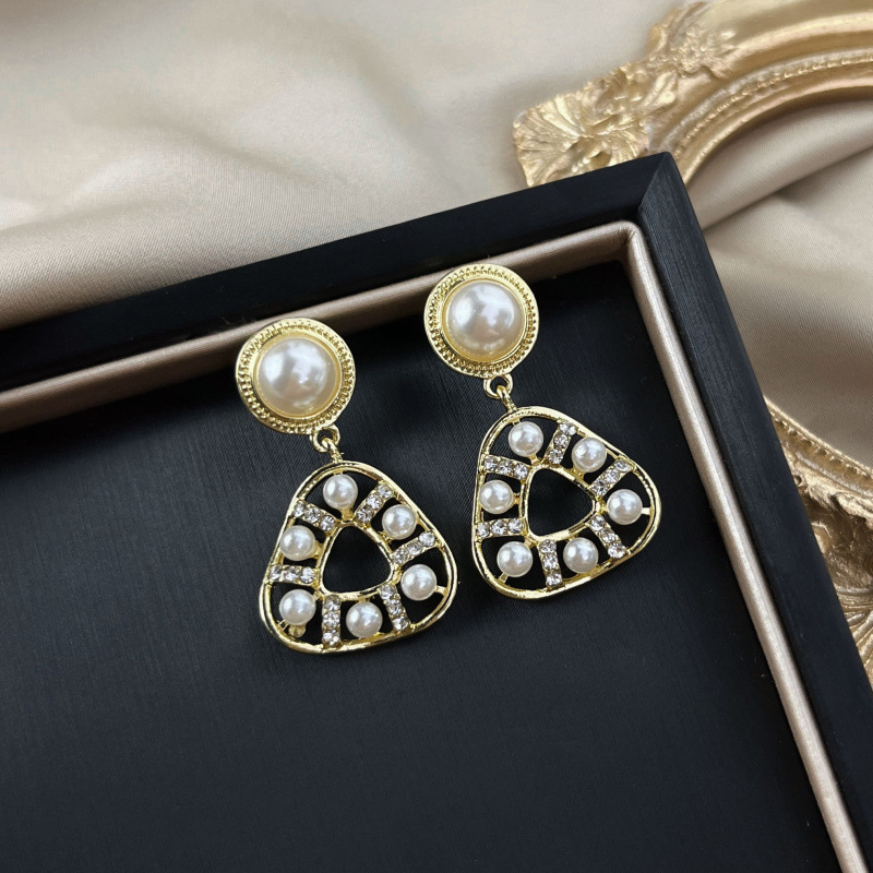 S925 Silver needle Pearl geometric Triangle earrings, with a unique and distinctive hollowed-out design, are a new trendy and sweet ear accessory full figure