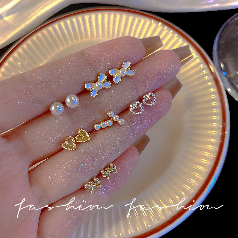 Super fairy-like small white stud earrings set, women's bow, star heart ear care stud earrings and earrings wholesale Specification drawing