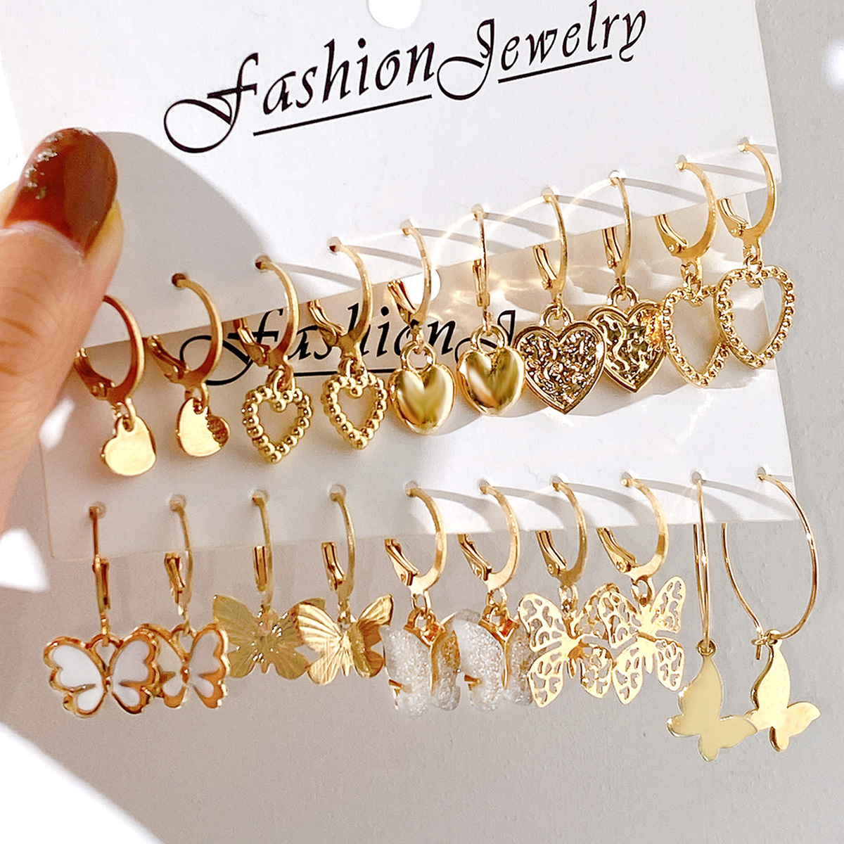 A 10-piece set of creative, retro and simple hollowed-out heart-shaped golden butterfly ear buckles from Europe and America full figure