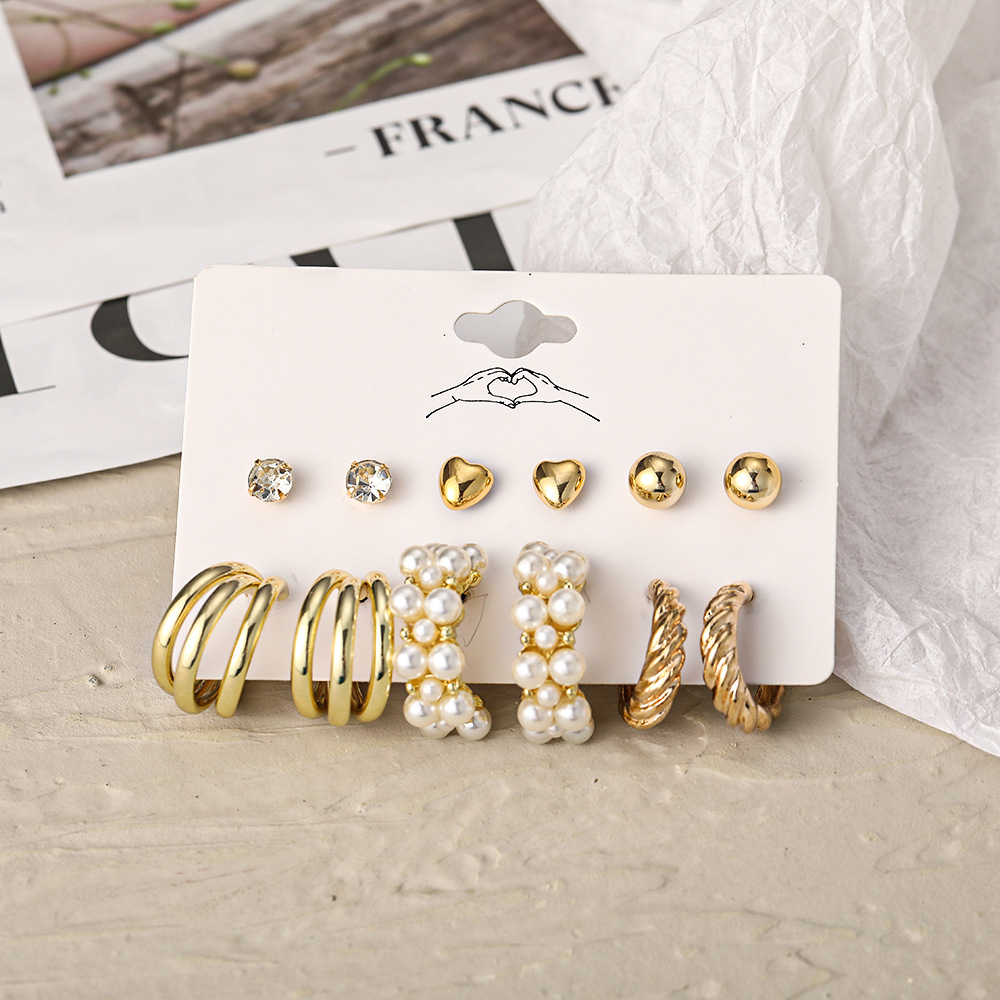 A cross-border best-selling set of 6-piece creative and retro golden heart-shaped earrings imitating pearl twist patterns for elegant women details Picture