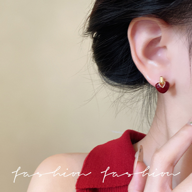 Heart-shaped stud earrings for women, a niche design with a sense of sophistication, a series of red oil-dripping New Year girl retro Christmas earrings Application Scenario