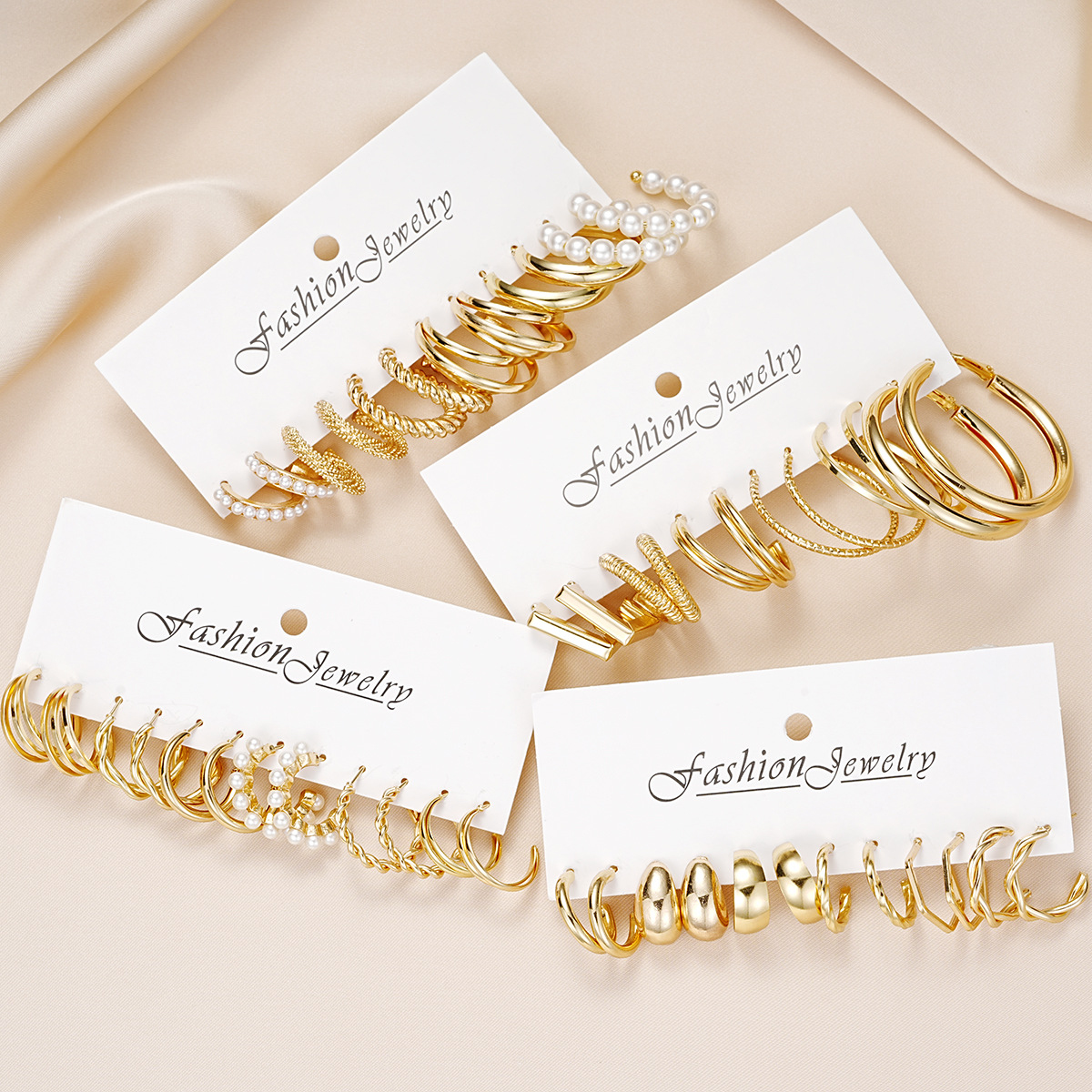 Cross-border best-selling metallic texture C-shaped earrings, creative geometric three-tube imitation pearl twist earrings and earrings set Application Scenario