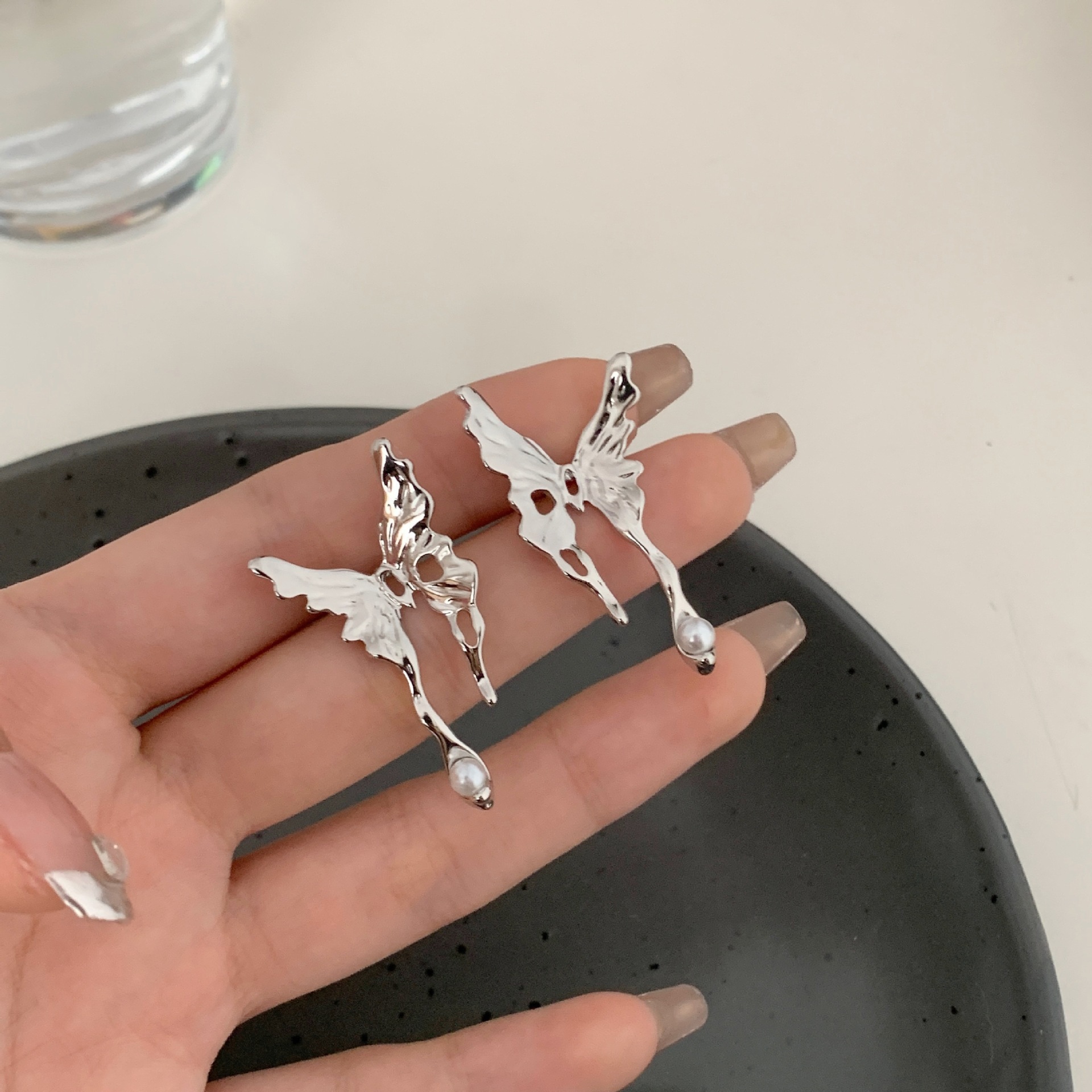 S925 Silver needle liquid butterfly Stud earrings with a light luxury and niche design sense, a cold style, and a sweet and cool personality Application Scenario