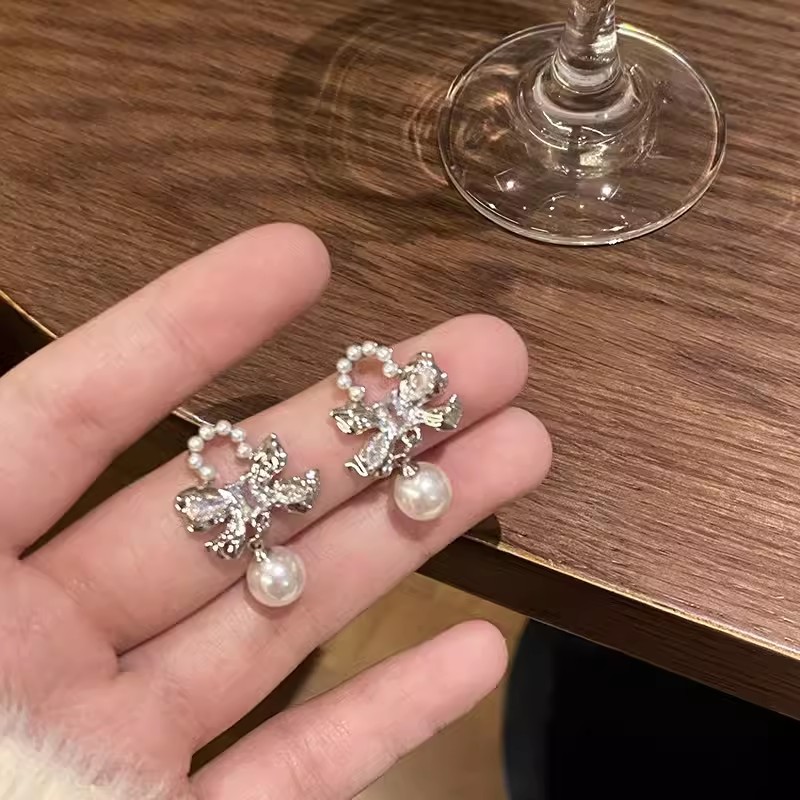 Bow pearl stud earrings for women, light luxury and exquisite chanel-style earrings, niche design, Korean-style high-end earring accessories details Picture