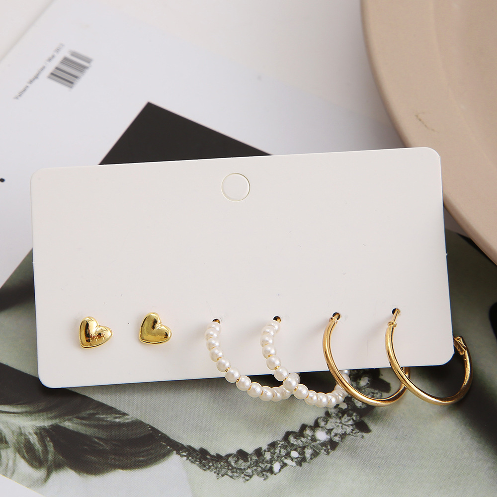 A simple cross-border earring set from Europe and America, featuring 3 pairs of heart-shaped stud earrings and creative, retro and personalized pearl-like ear loops details Picture