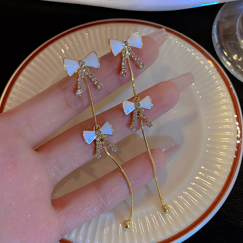 925 Silver needle Bow earrings, women's niche design sense, high-end long tassel earrings, personalized and elegant, trendy earrings full figure