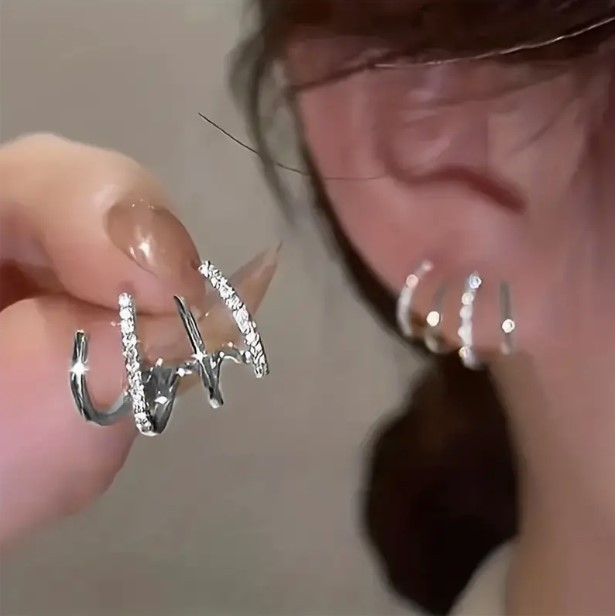 TEMU's best-selling four-prong ear stud earrings feature a creative and simple design with rhinestones and a cold style. The arc-shaped four-prong stud earrings exude a sense of design full figure