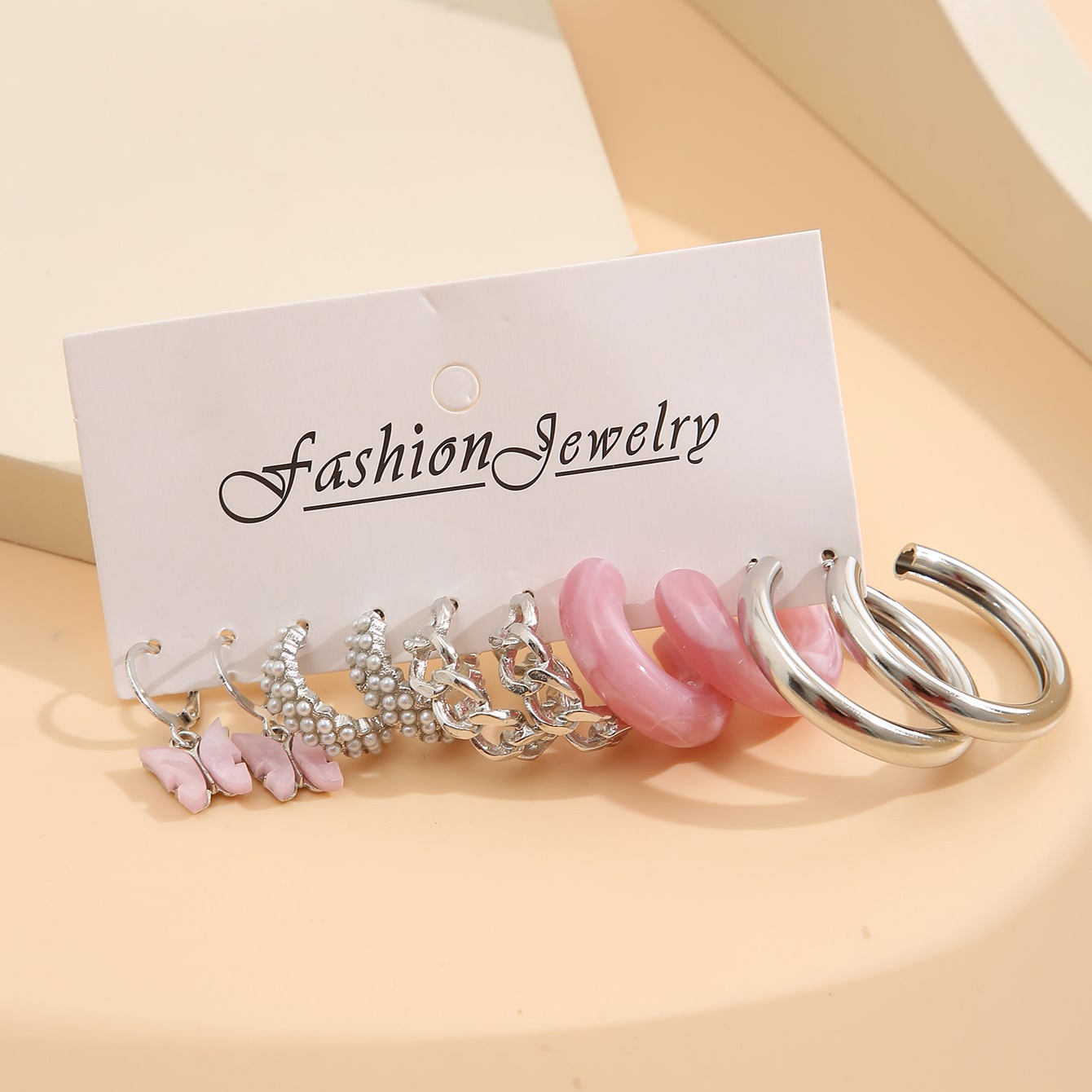 Creative and simple pink acrylic C-shaped chain earrings, a new cross-border pearl butterfly earring set of 5 pieces Application Scenario