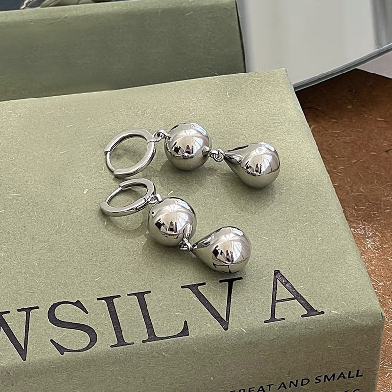 European and American cold style silver round ball temperament earrings, ins heavy industry bell earrings, niche design sense, exaggerated ear buckles Application Scenario