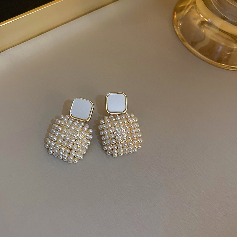 Square pearl earrings for women, from Dongdaemun, South Korea, with a forest-style, ethereal charm. The stud earrings exude a sense of sophistication and are simple yet versatile full figure