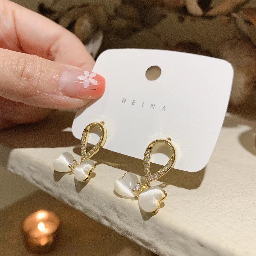 S925 Silver Needle elegant Earrings, fashionable accessories, cat-eye bow earrings, Korean stud earrings, sweet and ladylike charm details Picture