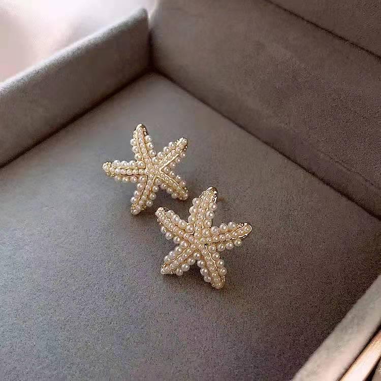 shein, a best-selling cross-border product from Europe and America, is a creative and fashionable female earring with a sea star full of pearls full figure