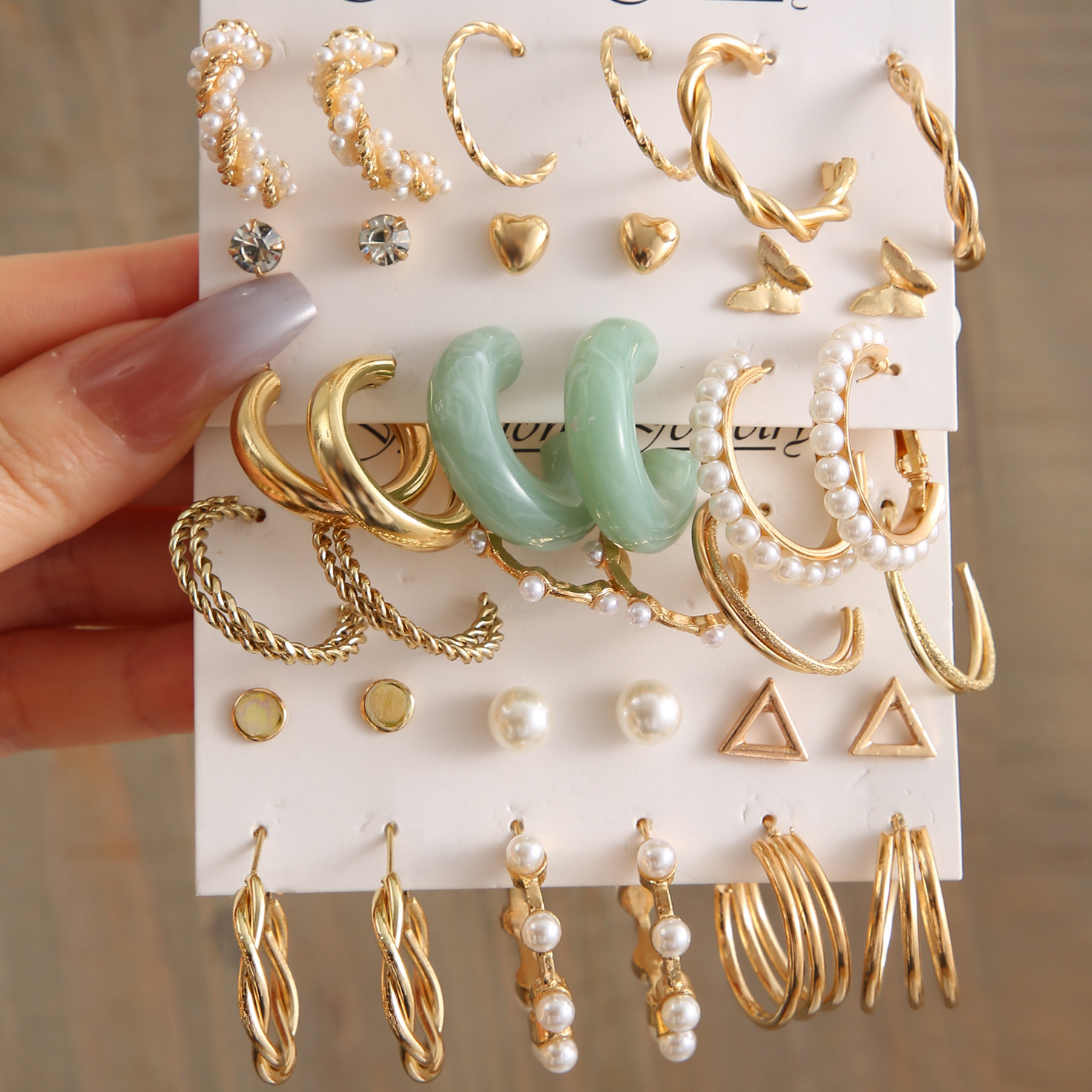 Wholesale of popular C-shaped earrings from Europe and America, creative retro imitation pearl circle earrings set of nine pieces full figure