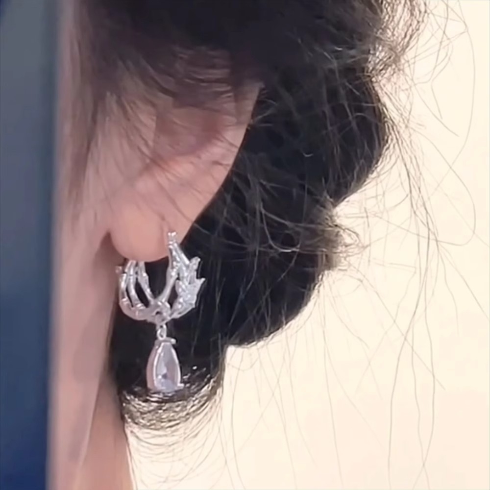 Retro and cold waterdrop zircon stud earrings, a niche design for women with a light luxury and high-end feel, featuring hollowed-out butterfly earrings and earrings full figure
