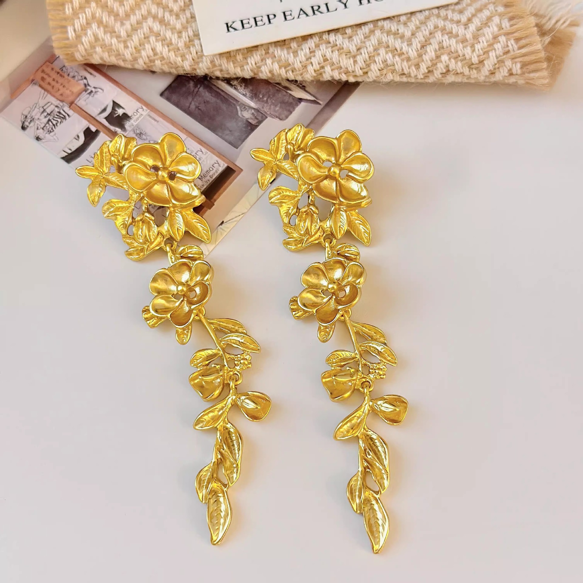 High-end, light luxury and exaggerated style earrings for women, retro golden long leaf earrings, suitable for round and square faces details Picture