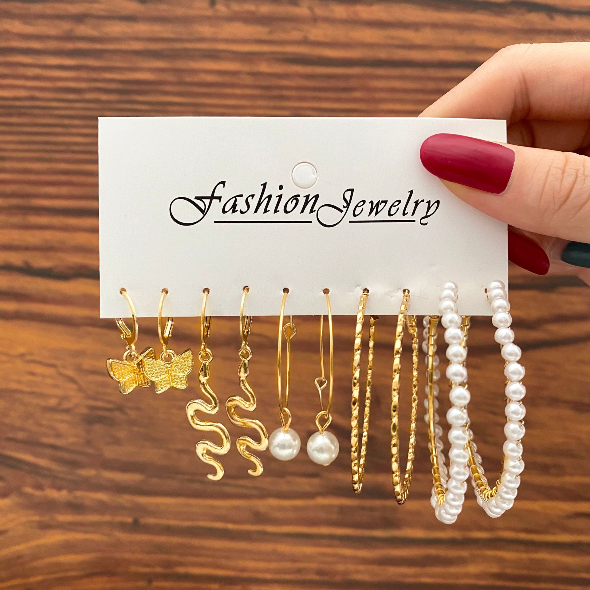 European and American independent station Star and Moon snake-shaped earrings set 5 pairs creative retro butterfly imitation pearl pendant earrings full figure