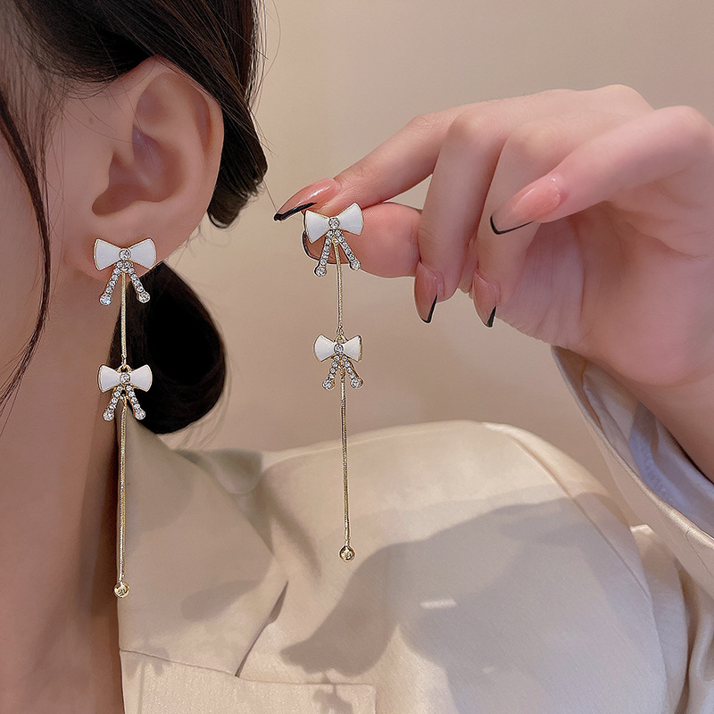 925 Silver needle Bow earrings, women's niche design sense, high-end long tassel earrings, personalized and elegant, trendy earrings Application Scenario
