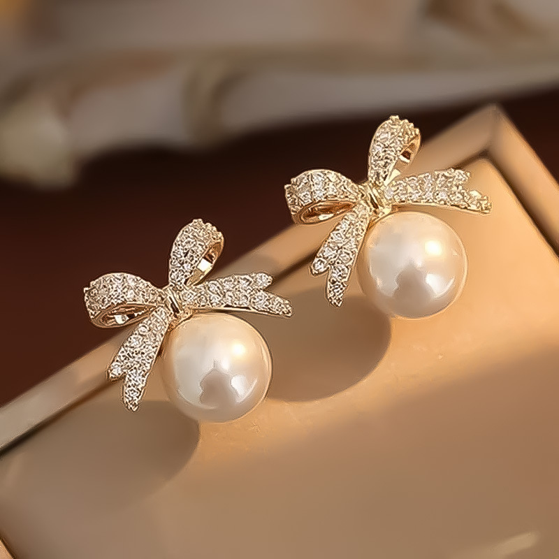 Cross-border best-selling bow, sparkling diamond, retro imitation pearl stud earrings for women, creative and high-end look, elegant and exquisite earrings full figure